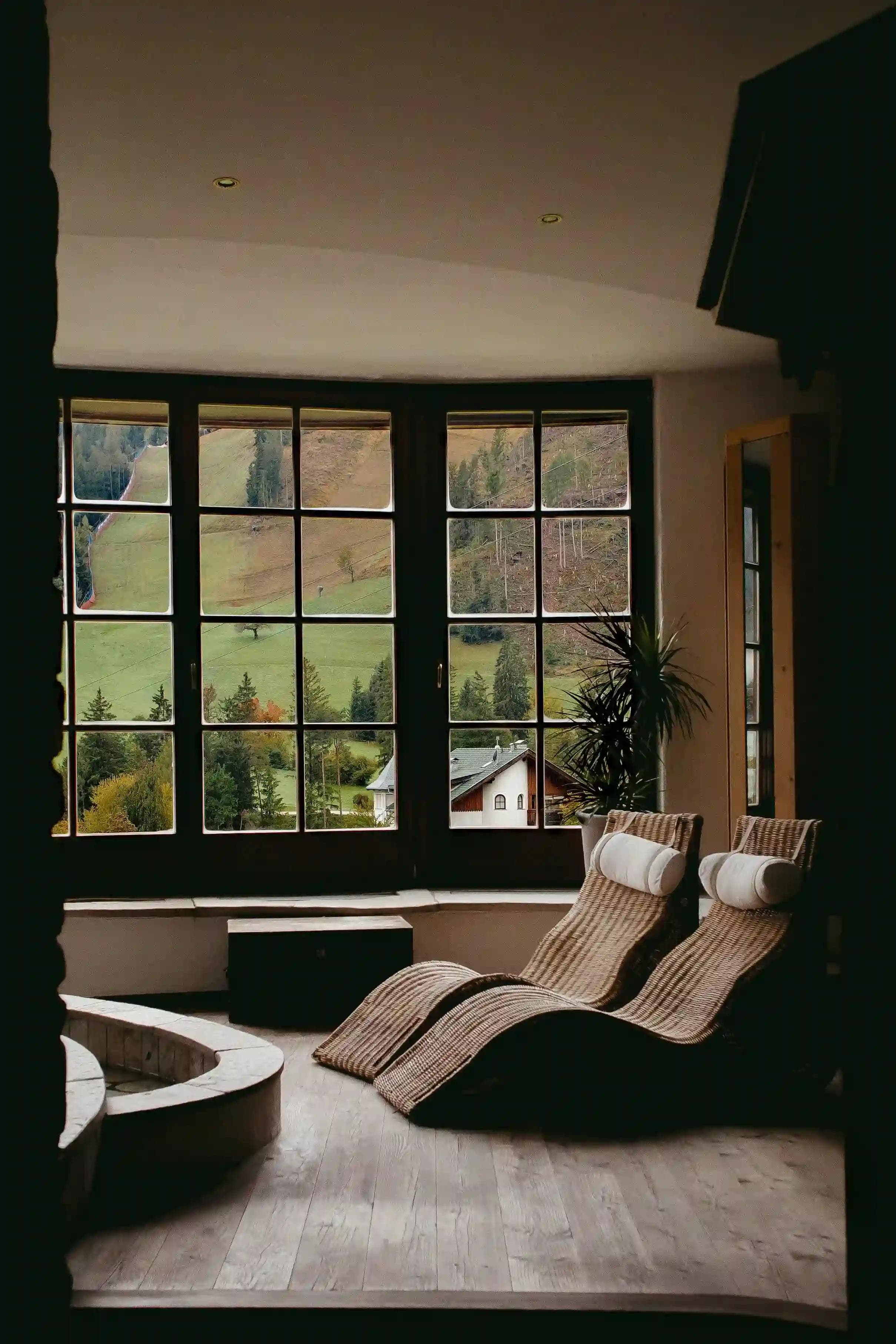 View of the valley with two luxury sun loungers and parquet flooring
